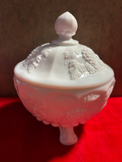 Vintage Westmoreland Footed Milk Glass Compote with Lid: Vintage from the 1960sThis is a lovely, vintage footed milk glass compote dish with lid made by Westmoreland. The piece is decorated with grapes and greenery on both the base and the lid. The piece is