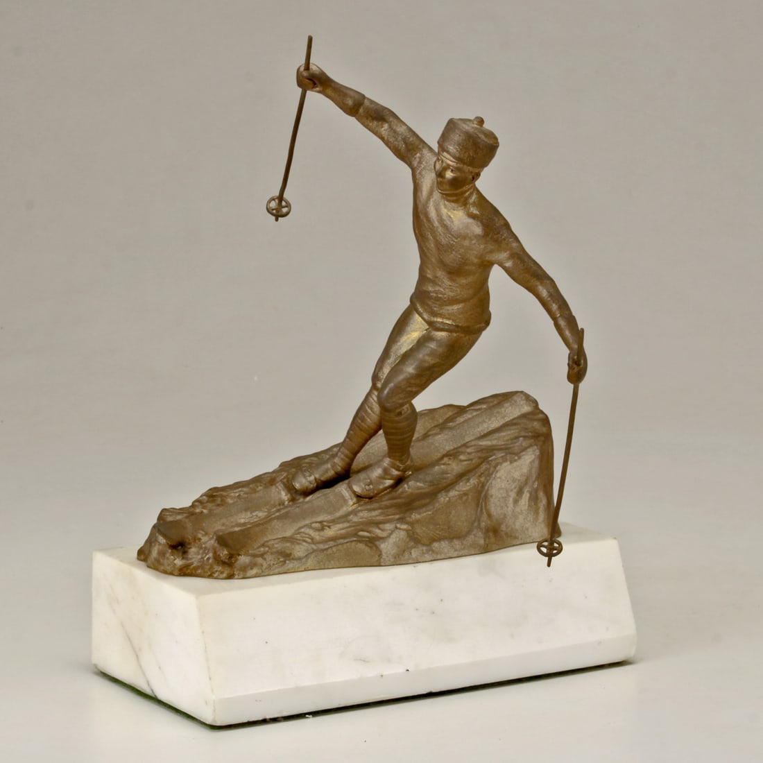AUSTRIAN, EARLY 20TH CENTURY "ALPINE SKIER" K. THENN VIENNA BRONZE: UN-KNOWN ARTIST AUSTRIAN, EARLY 20TH CENTURY Figural Alpine Skier Signed: K. Then (in bronze) COPYRIGHT THENN VIENNA (foundry stamp). Figural bronze depicting an alpine skier has a fine do