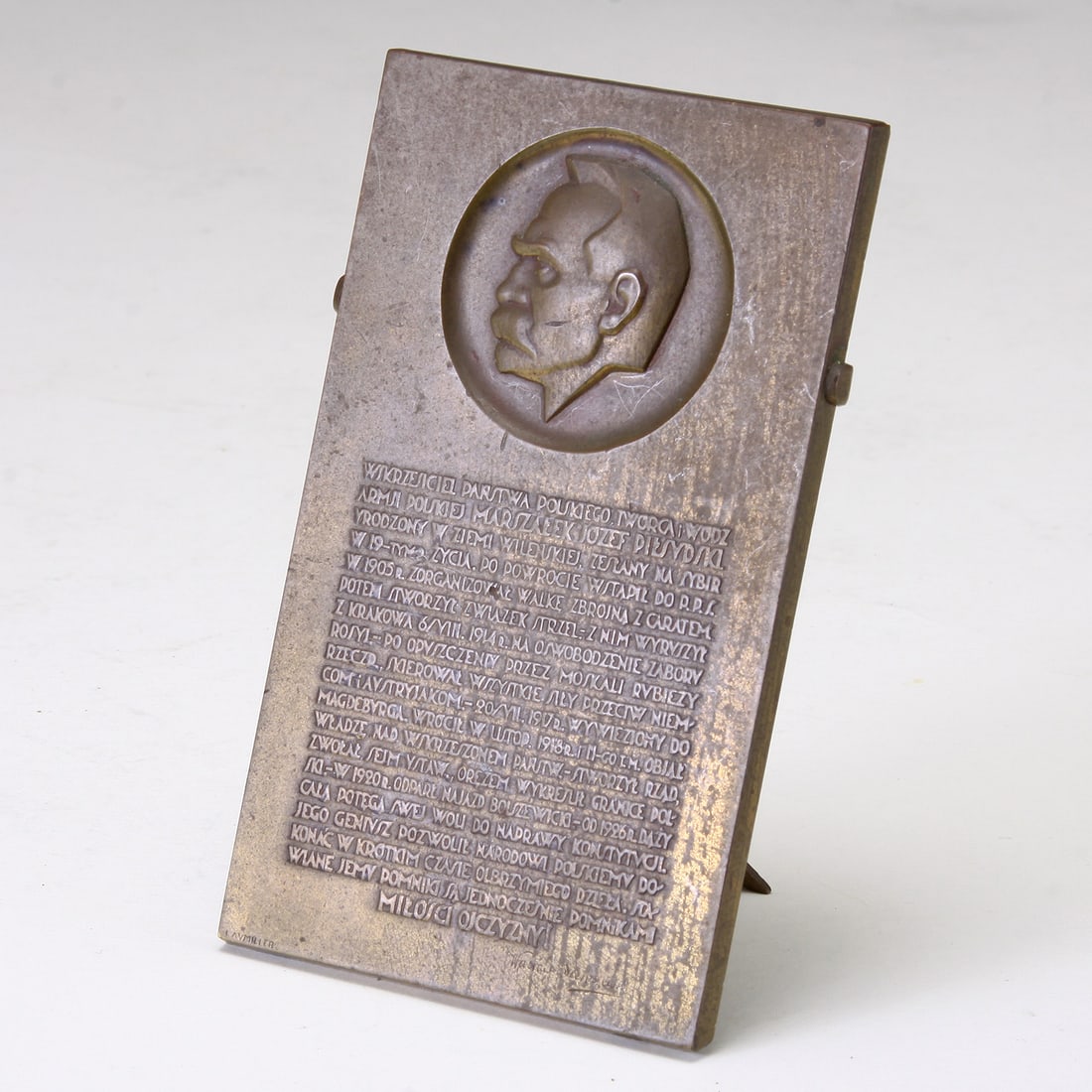 A POLISH PATINATED BRONZE MEDAL 19TH CENTURY WAC?AW SIEROSZEWSKI: A POLISH PATINATED BRONZE MEDAL, 19TH CENTURY 4 X 2.5” inches. FROM THE ESTATE OF RICHARD WRIGHT The rectangular medal decorated with the left facing profile: Wac?aw Sieroszews
