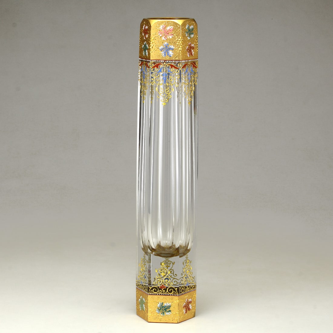 A Moser Enameled and Gilt Glass Arabesque 6 Sided Vase: A Moser Enameled and Gilt Glass Arabesque 6 Sided Vase Karlsbad, Czech Republic ca. 1900 Marks: MOSER 788 Austria No. 717 Lot Note(s): With applied gilt Arabesque decoration with enameled leav