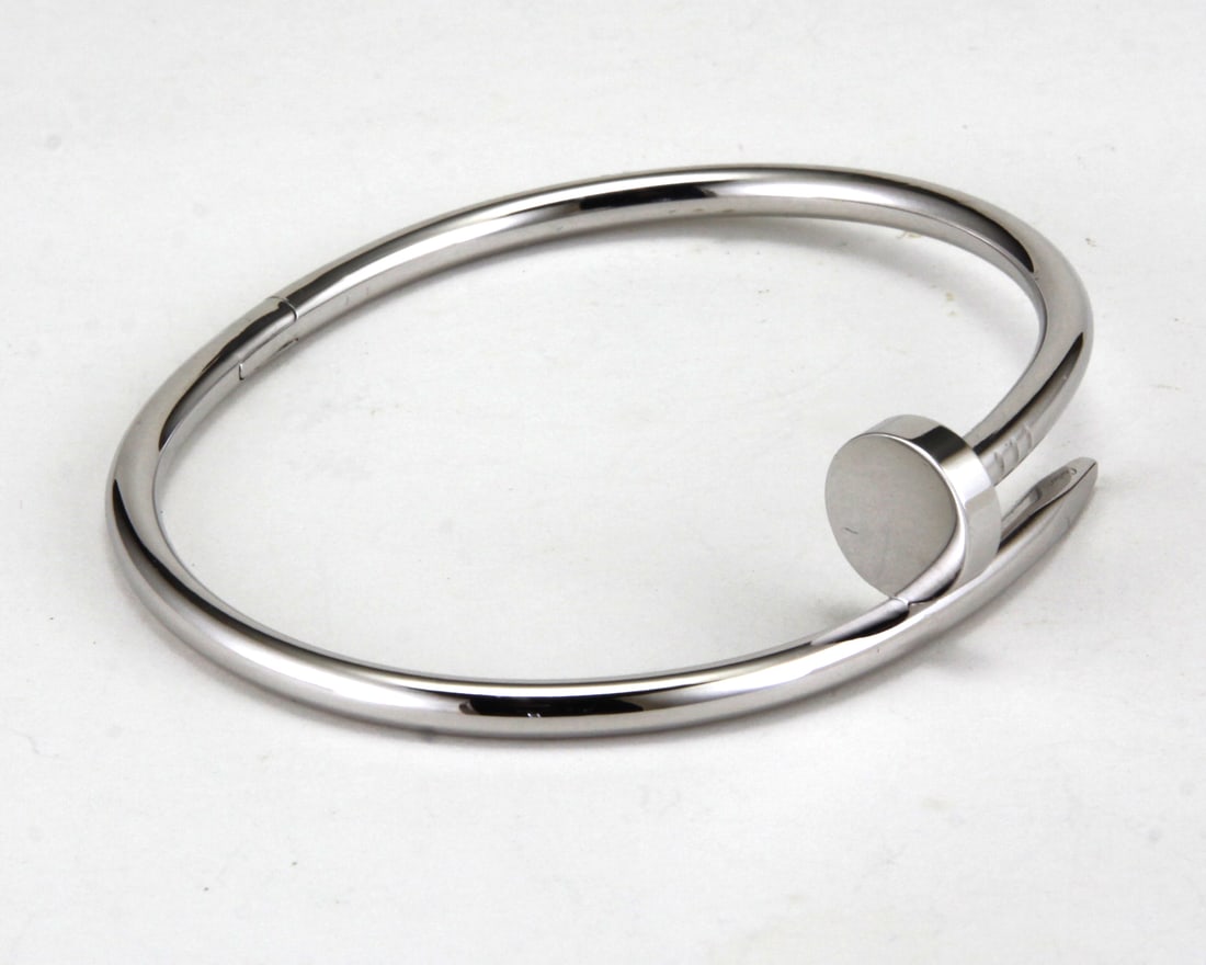 18kt White Gold Cartier “Juste Un Clou?? Sz: 18 Nail Bangle Bracelet B&P: 18kt White Gold Cartier “Juste Un Clou” Sz: 18 Nail Bangle Bracelet B&P. Size: 18, Finish: Rhodium. Signed Cartier with serial number and hallmarks. Pre