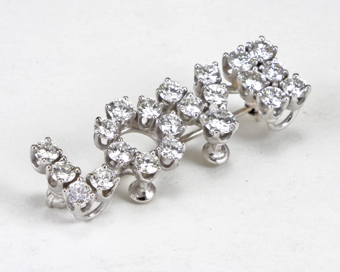 2.39CTTW DIAMOND, 18KT WHITE GOLD “LOVE?? BROOCH: 2.39CTTW DIAMOND, 18KT WHITE GOLD “LOVE” BROOCH. The brooch crafted in 18kt white gold features: 22 natural round brilliant cut diamonds ranging in weight from: 10-17pts of H-I color and V