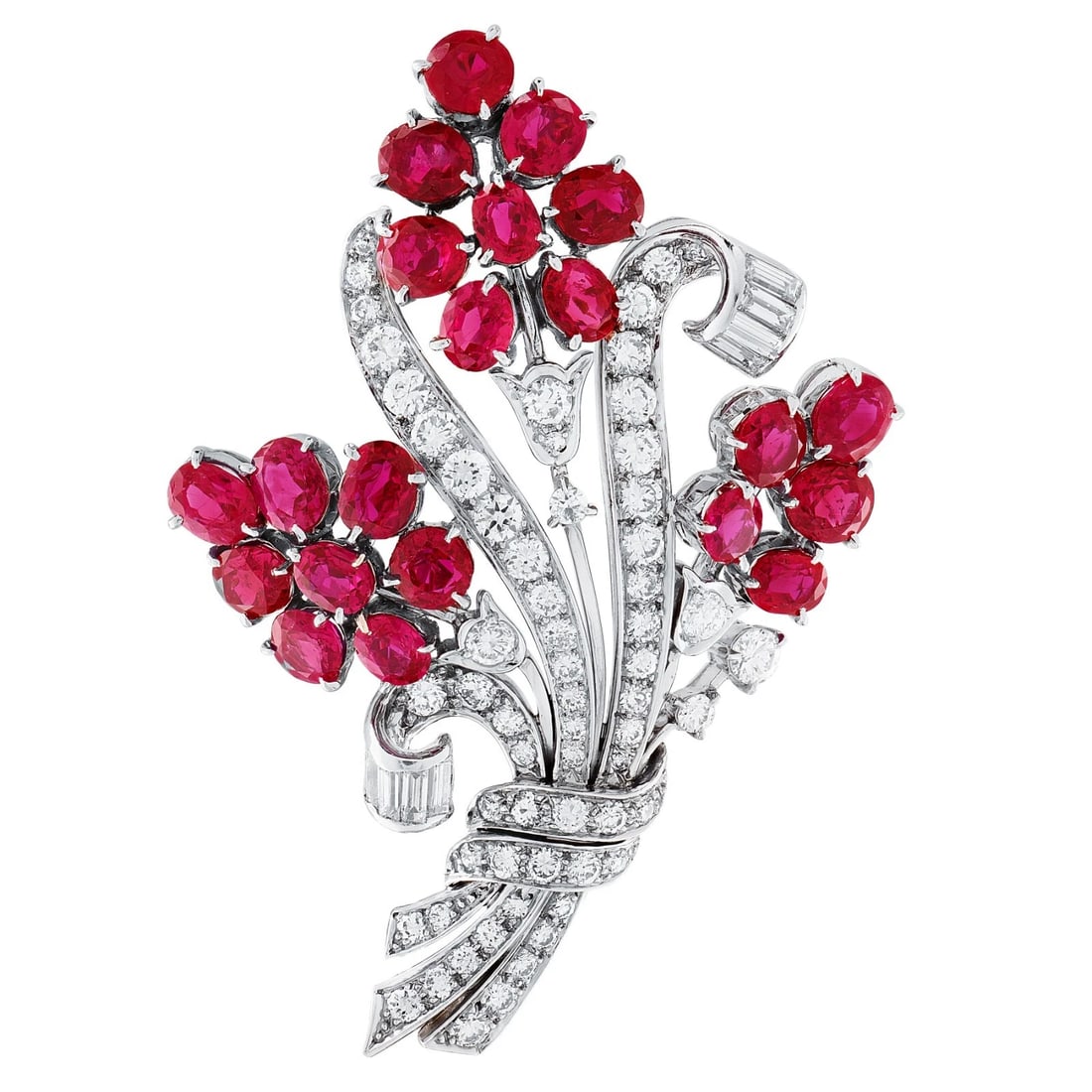 18K WHITE GOLD DIAMOND AND RUBY FLORAL BROOCH 10.60CTTW: 18K White Gold Diamond and Ruby Floral Brooch. Decorated as a floral brooch consisting of: diamonds of H-I color and VS2-SI1 clarity. (round brilliant, marquise, and baguette cut). CTTW: 6.55ct Settin