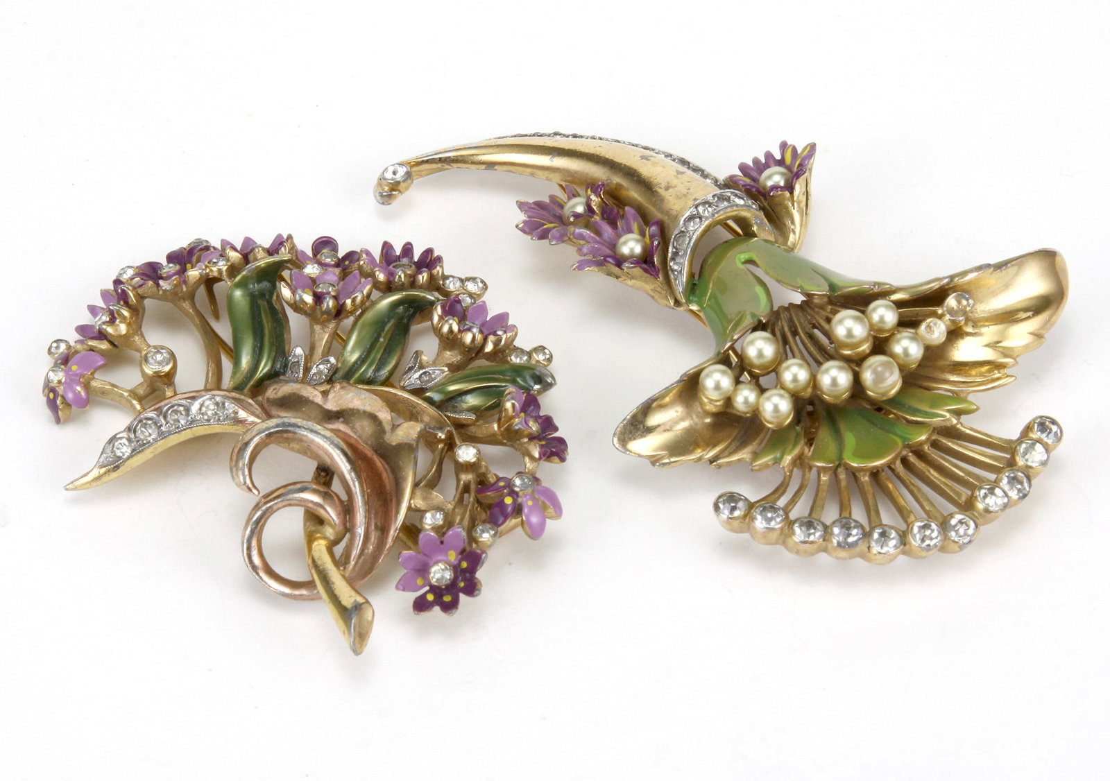 (2) Circa 1940 Ralph De Rosa (1934–1970) Brooches: Set of 2 Ralph De Rosa (1934–1970) Brooches. Crafted using 14kt gold plating, translucent pinkish purplish enameling, leafs, ribbons, white rhinestones and simulated pearls. Stamped: R. De