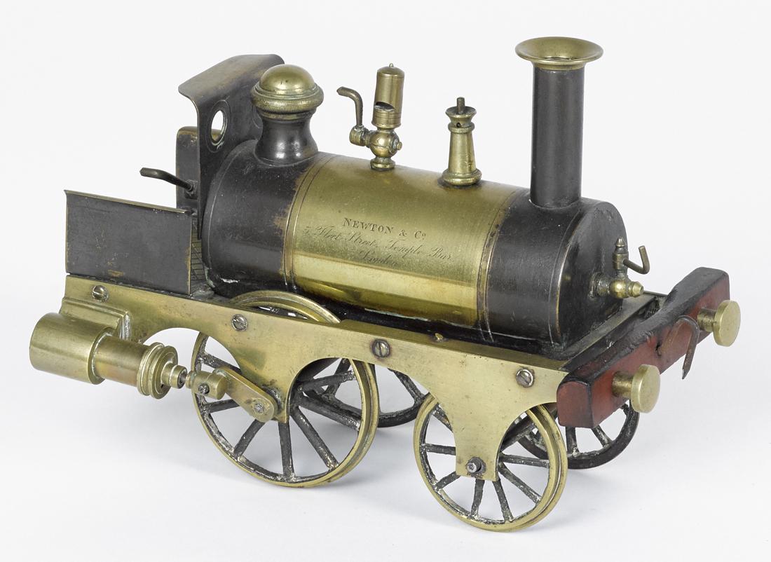 Stevens dockyard 2-2-0 steam powered brass locomotive,: Stevens dockyard 2-2-0 steam powered brass locomotive, retaining a paint decorated boiler, inscribed Newton NCO 5 Fleet Street, Temple Bar London, with a crosshatched pattern foot plate, 6'' h., 8'' w