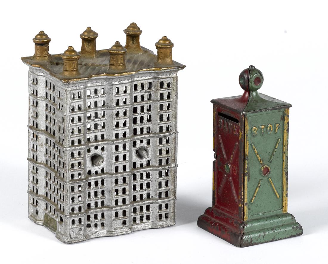 Two cast iron still banks, to include a Dent stop sign, (1 of 1)