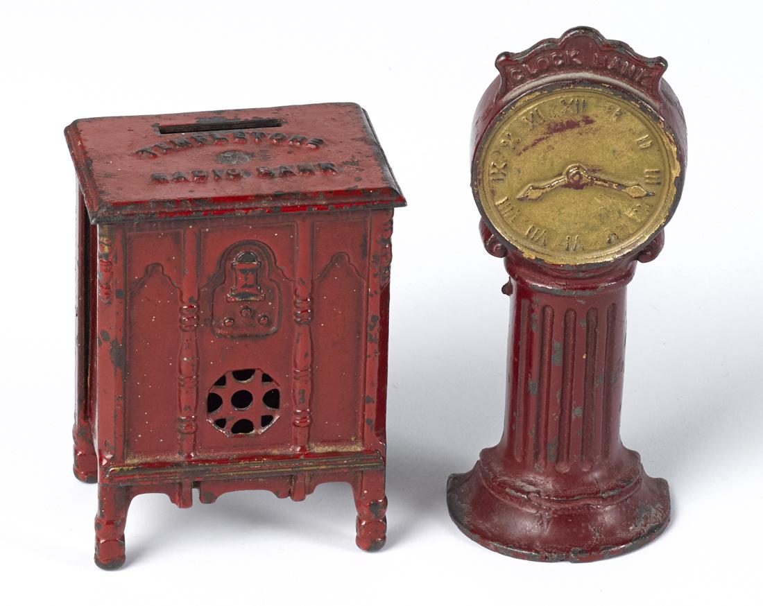 Two cast iron still banks, to include a street Clock (1 of 1)