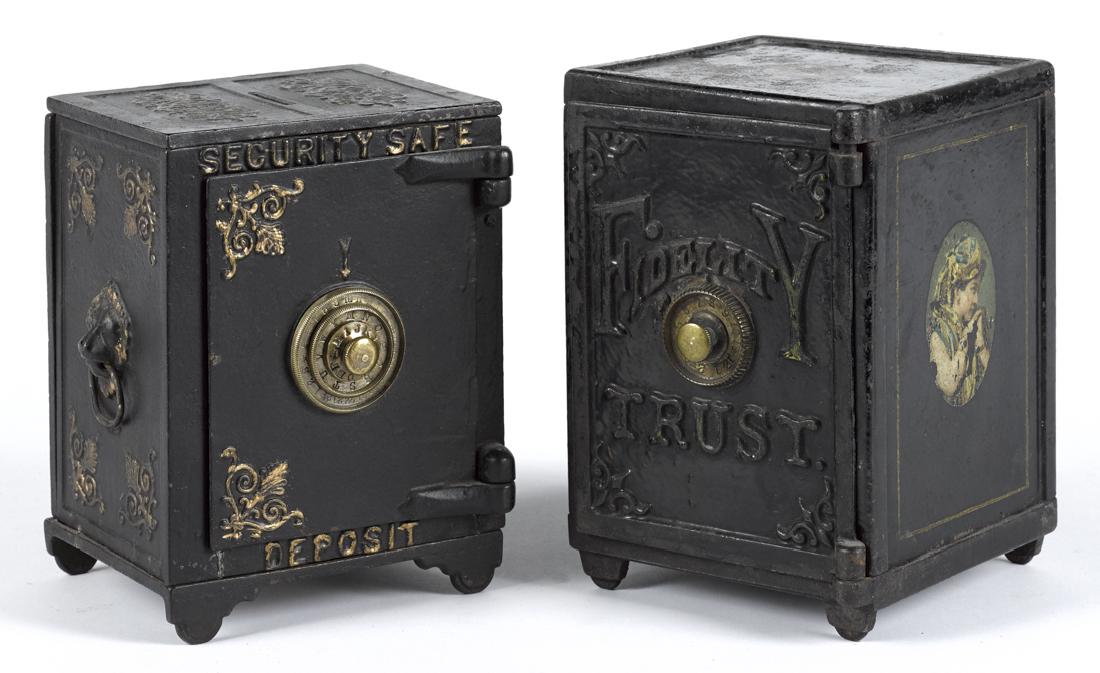 Two large cast iron safe still banks, to include a (1 of 1)