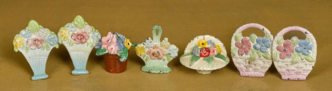 Seven Hubley cast iron flower paperweights and: Seven Hubley cast iron flower paperweights and novelties, tallest - 2''. Provenance: The Donal Markey collection, Bertoia Auction, March 2011, lot 587.