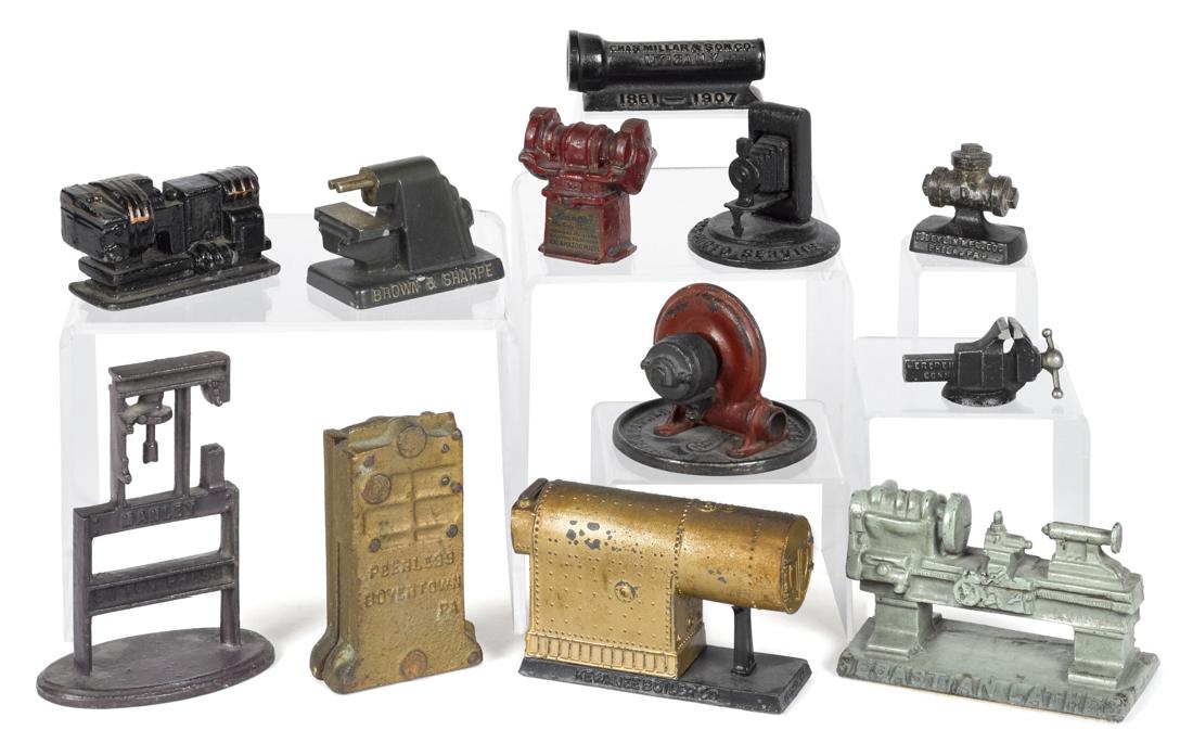Twelve cast iron advertising paperweights and (1 of 1)
