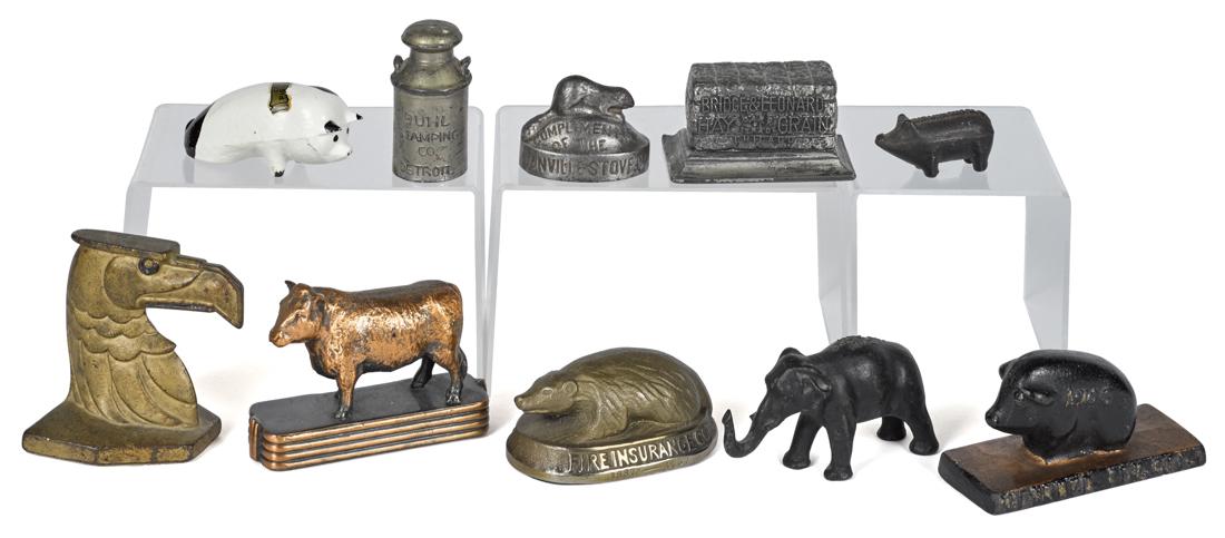 Ten cast iron advertising paperweights and novelties, (1 of 1)
