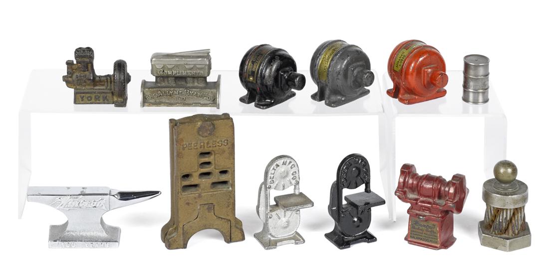 Twelve cast iron advertising machine paperweights, to (1 of 1)
