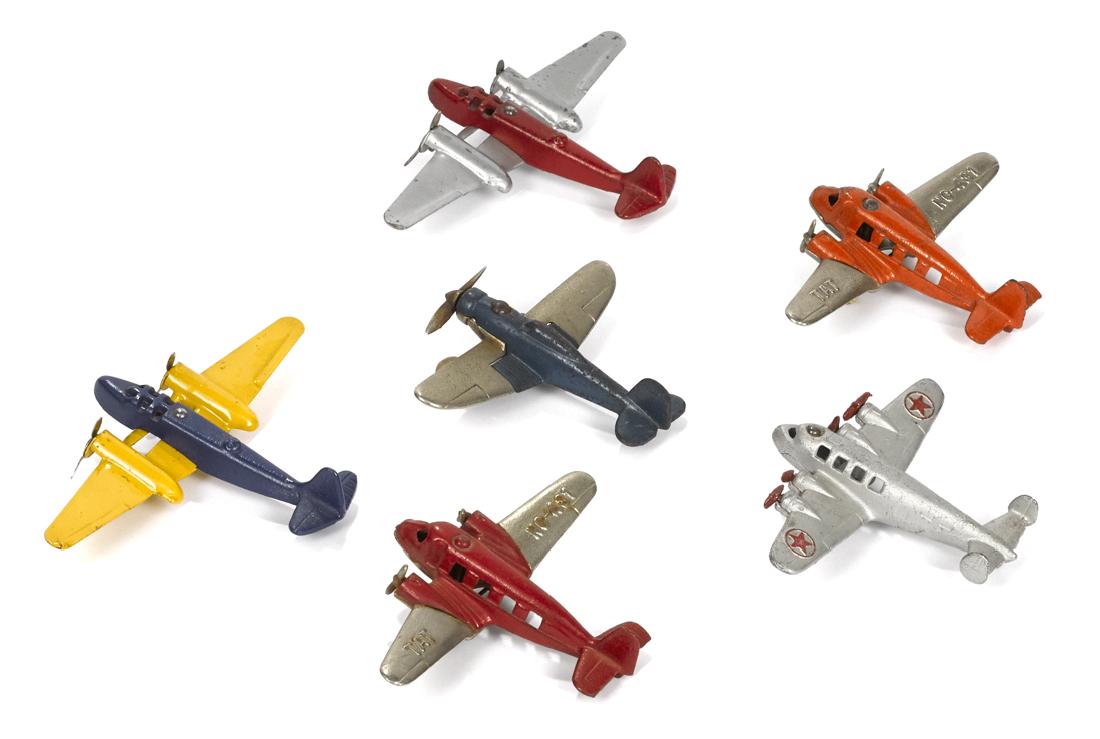 Six small cast iron airplanes, to include two TAT (1 of 2)