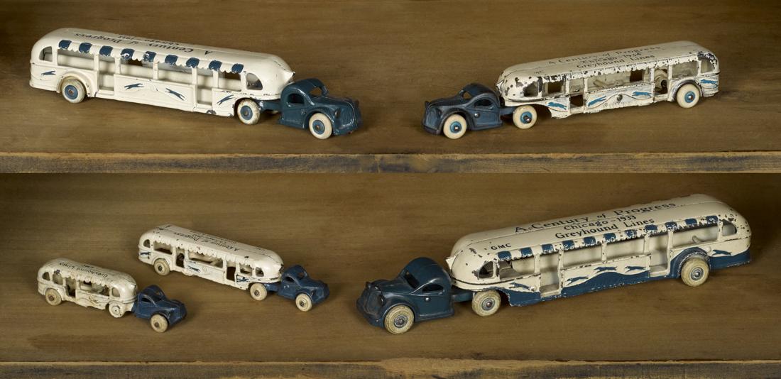 Five Arcade cast iron graduated size Greyhound Lines -: Five Arcade cast iron graduated size Greyhound Lines - GMC tandem buses, one inscribed A Century of Progress Chicago - 1934, three inscribed 1933, 14 1/2'' l., 11 3/4'' l., 10 1/4'' l., 7 1/2'' l., an