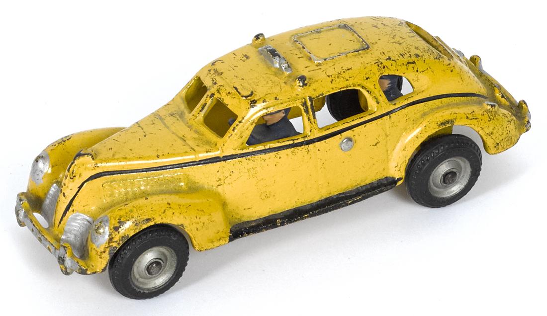 Arcade cast iron yellow cab with a painted driver and a (1 of 2)