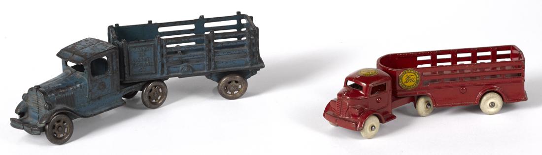 Two cast iron stake back trailer trucks, to include an (1 of 2)
