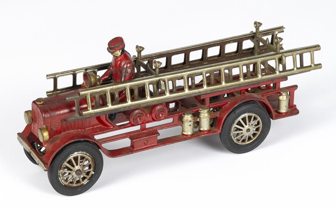 Hubley cast iron fire ladder truck with a painted: Hubley cast iron fire ladder truck with a painted driver, 13'' l.