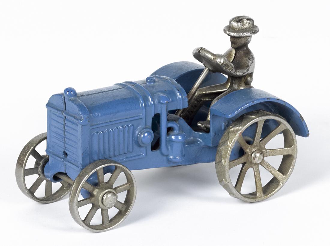 Rare Kilgore cast iron McCormick Deering 10-20 tractor: Rare Kilgore cast iron McCormick Deering 10-20 tractor with a nickel-plated driver, 5 3/4'' l.