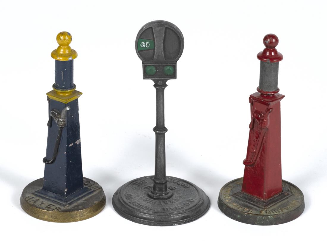 Three cast iron advertising road sign and gas pumps, to (1 of 1)