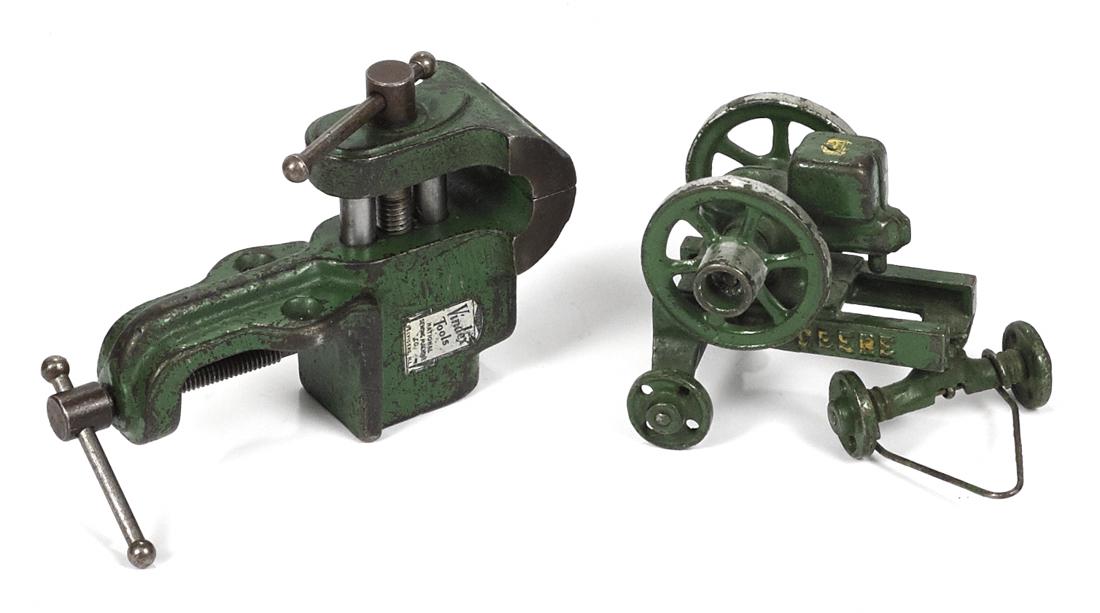 Two Vindex cast iron toys, to include a John Deere hit: Two Vindex cast iron toys, to include a John Deere hit and miss gas engine, 3 1/4'' h., and a vise, 5 3/4'' h.