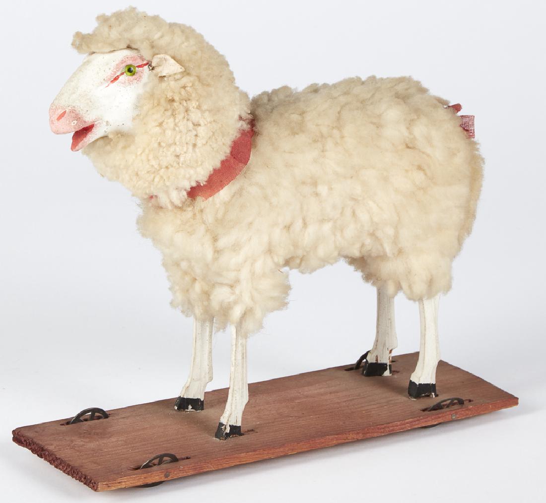Stick leg sheep on platform pull toy (1 of 1)