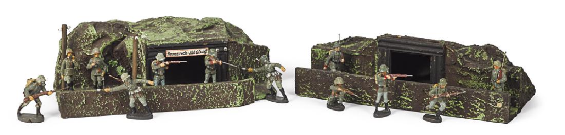 Lineol painted composition gas mask soldiers: Lineol painted composition gas mask soldiers, together with two communication trenches, to include twelve figures, ten with rifles, one with a telephone and one with binoculars, trenches are 12 1/2''