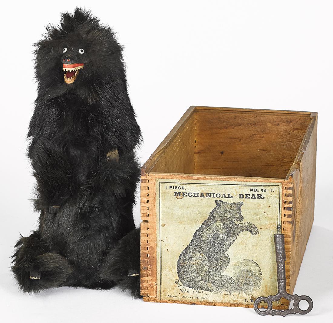 Ives, Blakeslee & Co fur covered mechanical bear: Ives, Blakeslee & Co. fur-covered clockwork mechanical bear, with the original box, having a wooden face, hands and feet, with paper teeth, 9'' h.