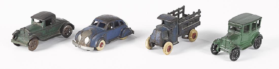 Four small cast iron vehicles (1 of 2)