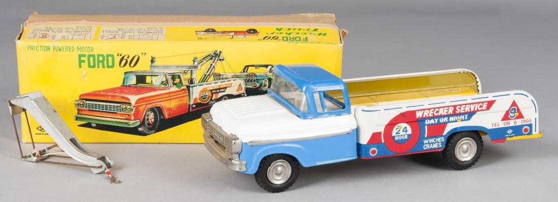 Japanese tin litho friction Ford 60 Wrecker Truck: Japanese tin litho friction Ford 60 Wrecker Truck, with the original box, 14'' l.