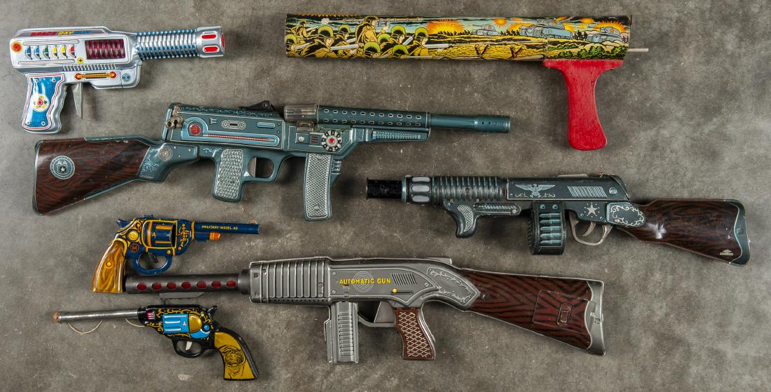 Collection of six tin litho toy guns: Collection of six tin litho toy guns, to include a Japanese space ray gun, Marx military model 45, a Japanese cork gun, and three Japanese battery operated machine guns, together with a cardboard Ren