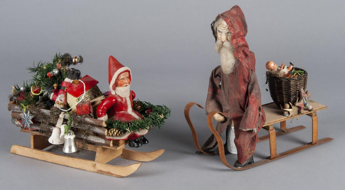 Two Santa Claus in sleigh toys (1 of 1)