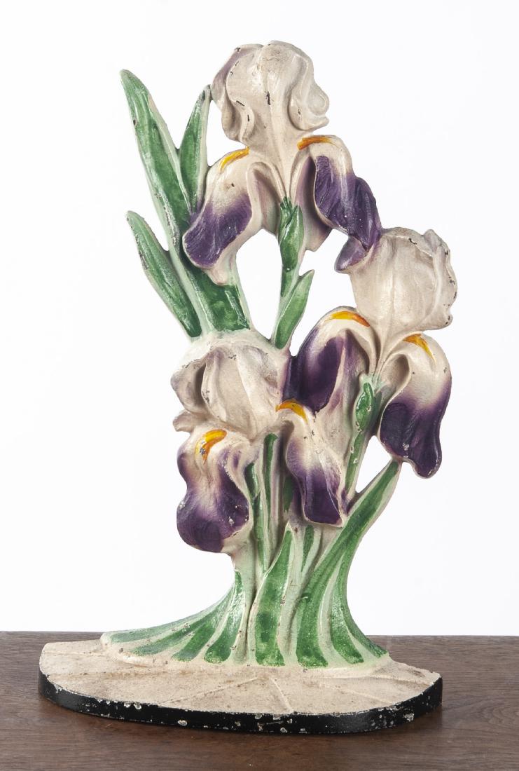 Hubley cast iron purple iris doorstop: Hubley cast iron purple iris doorstop, 10 3/4'' h.