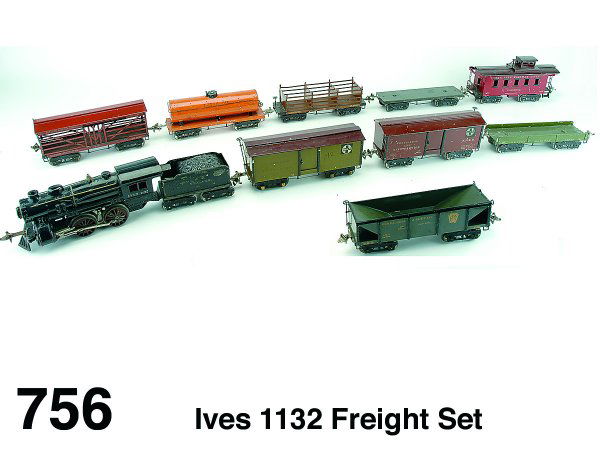 Ives 1132 Freight Set: painted cast iron 0-2-0 American steam profile electric engine, #40 tender (paint flaking) and 9 painted tin cars: #191 Penna. RR sectioned freight, 2 #192 Santa Fe reefer cars - SFRR and SFRD, #193 l