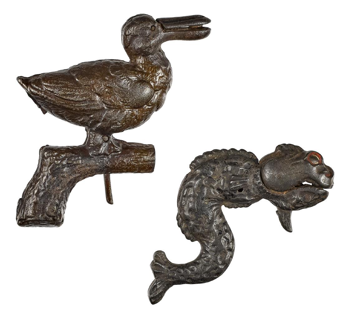 Two cast iron animated cap guns: Two cast iron animated cap guns, with embossed frames and grips, to include a serpent, 3 3/4'' l. and a pelican, 3 3/4'' l.