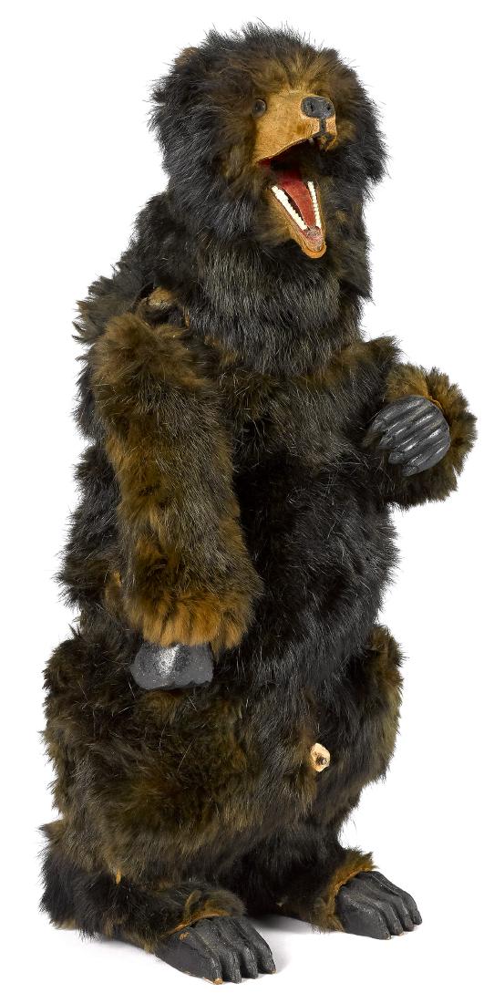 Clockwork fur covered bear: Clockwork fur covered bear, with opening and closing mouth, arms which move up and down, and carved and painted paws, 16 1/2'' h