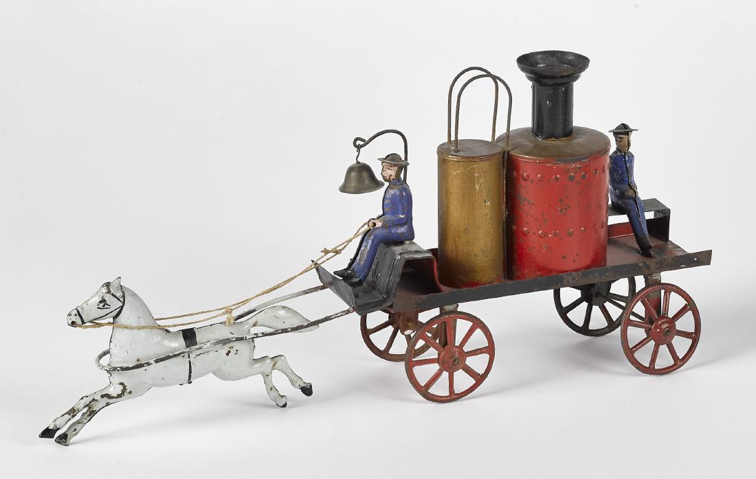 Early painted tin horse drawn fire pumper (1 of 2)