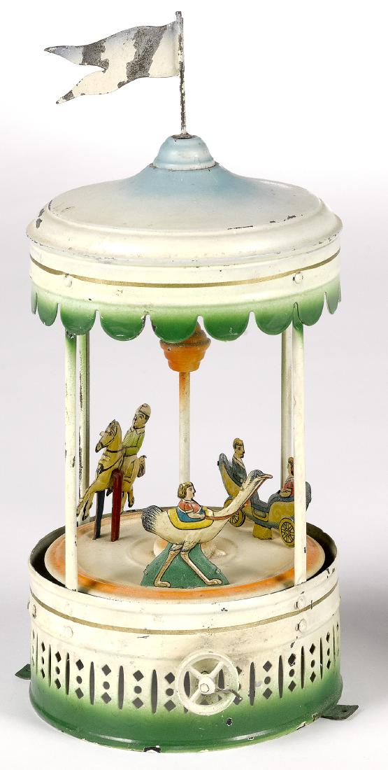 Painted and lithograph tin carousel steam toy (1 of 2)