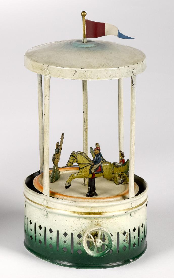 Painted and lithograph tin carousel steam toy (1 of 2)