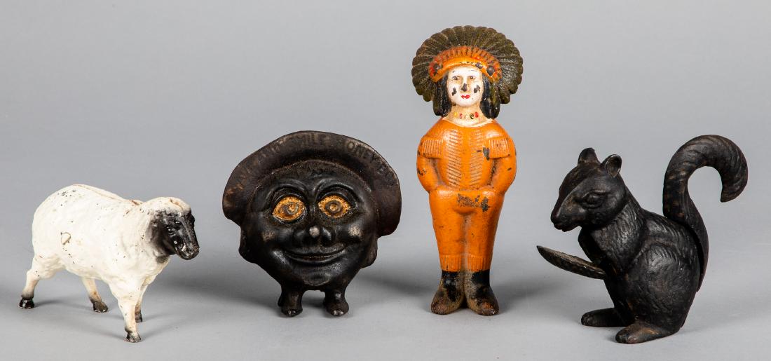 Three cast iron still banks, etc.: Three cast iron still banks, to include an Indian, sheep and Save and Smile bank, together with a squirrel nutcracker, 4 1/2'' h.
