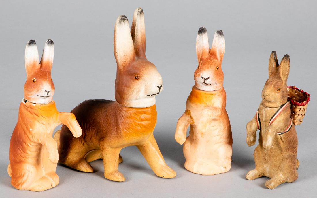 Four composition Easter rabbit candy containers: Four composition Easter rabbit candy containers, tallest - 7 1/4''.