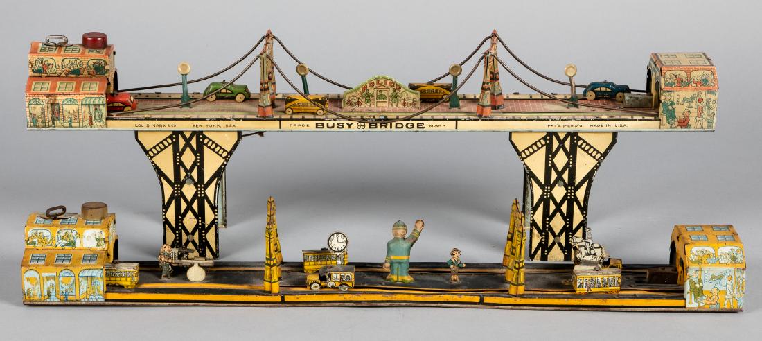 Marx tin litho wind-up Busy Bridge, etc.: Marx tin litho wind-up Busy Bridge, 24'' l., together with a Marx tin litho wind-up Main Street, 24'' l.