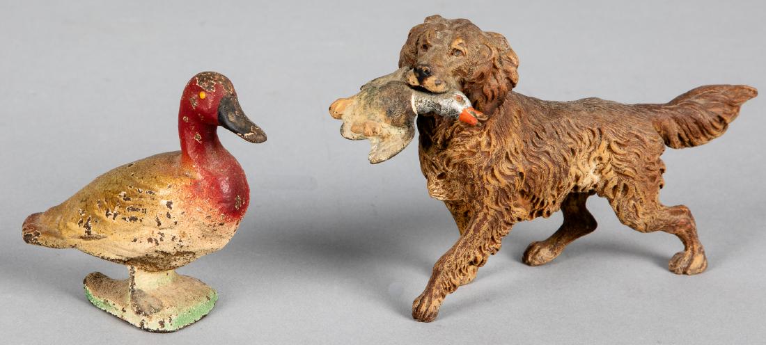 Cold painted bronze retriever with duck, etc.: Cold painted bronze retriever with duck, 5 3/8'' l., together with a cast iron duck bottle opener.