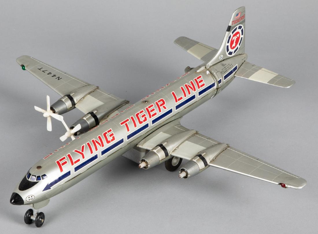 Japanese Marx tin Flying Tiger Line airplane: Japanese Marx tin lithograph Flying Tiger Line airplane, 20'' wingspan. Provenance: Estate of Jonathan Barrow, Los Angeles, California.