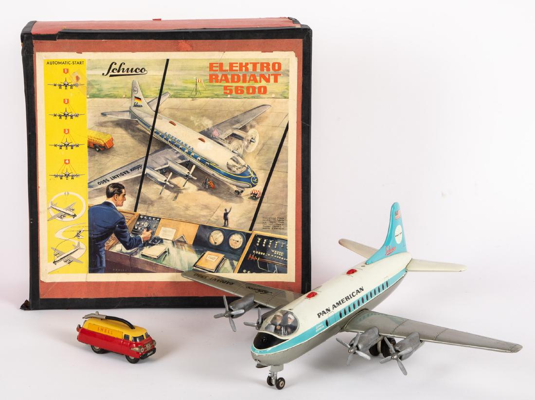 Schuco Elektro Radiant 5600 airplane, etc.: Schuco battery operated Pan American {Elektro Radiant 5600} airplane, with an empty Schuco box, together with a Shell tanker truck, 19" wingspan. Provenance: Estate of Jonathan Barrow, Los Angeles, Ca
