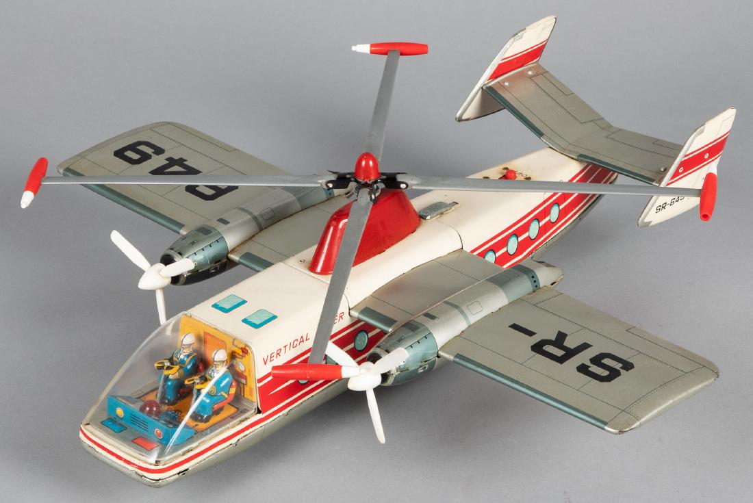 Japanese tin lithograph battery operated airplane: Japanese tin lithograph battery operated Vertical Liner airplane, 17 3/4'' wingspan. Provenance: Estate of Jonathan Barrow, Los Angeles, California.