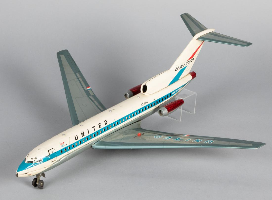 Cragstan Japanese Yonezawa tin lithograph airplane: Cragstan Japanese Yonezawa tin lithograph battery operated United Boeing 727 Mainliner airplane, 21'' wingspan. Provenance: Estate of Jonathan Barrow, Los Angeles, California.