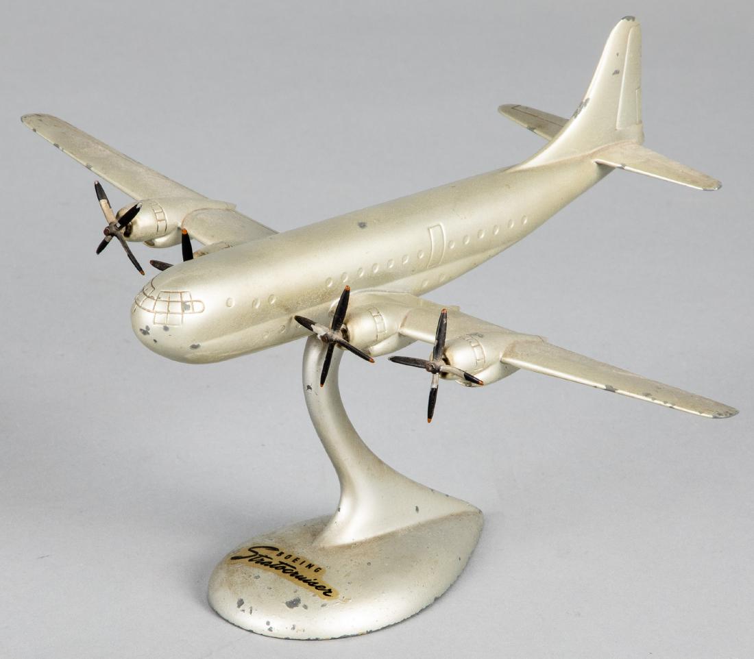 Boeing Stratocruiser travel agent model airplane: Boeing Stratocruiser travel agent model airplane, retaining a Bronzart label on underside, 5 1/2'' h., 12 1/2'' wingspan. Provenance: Estate of Jonathan Barrow, Los Angeles, California.