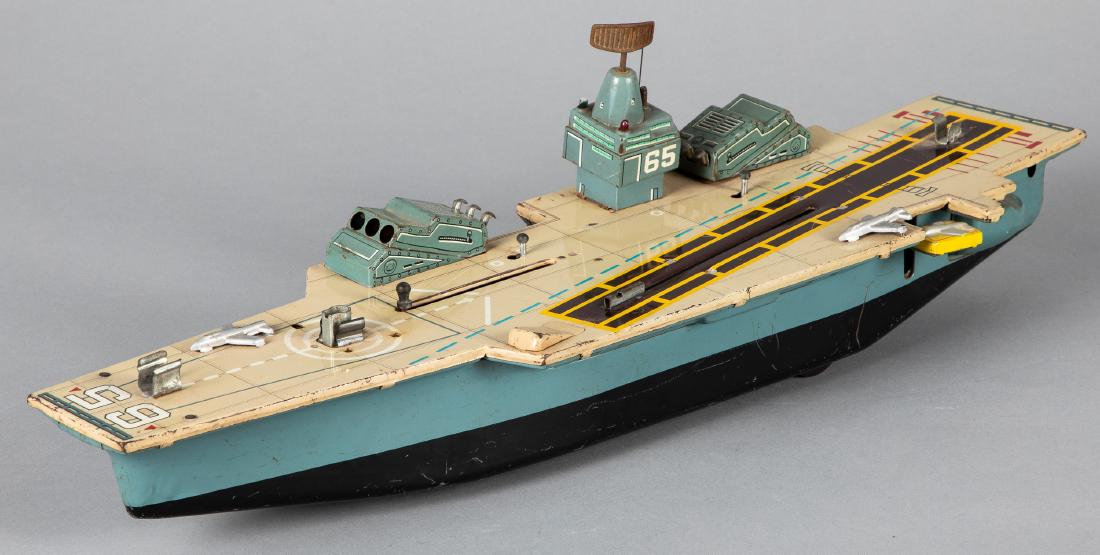Marx tin lithograph aircraft carrier: Marx tin lithograph battery operated aircraft carrier, 20'' l. Provenance: Estate of Jonathan Barrow, Los Angeles, California.
