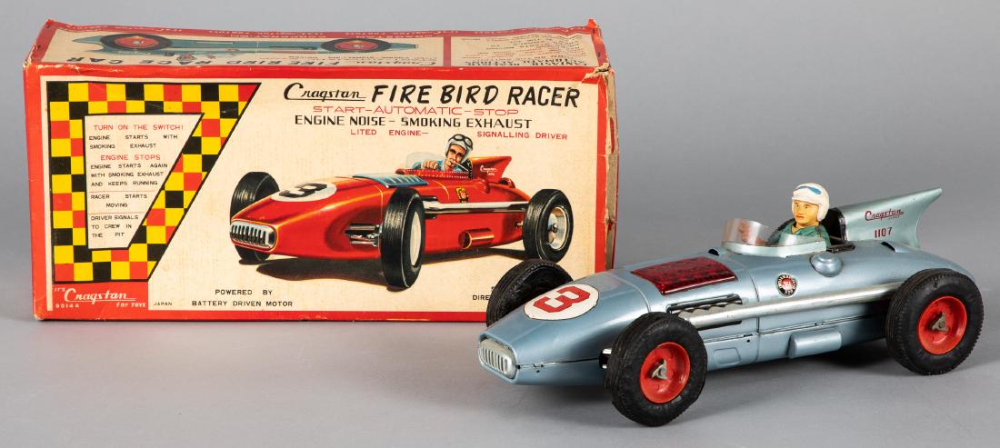 Japanese Cragstan tin lithograph Fire Bird Racer: Japanese Cragstan tin lithograph battery operated Fire Bird Racer car, in the original box, 14 1/2'' l. Provenance: Estate of Jonathan Barrow, Los Angeles, California.