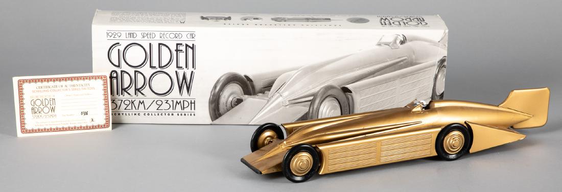Schylling contemporary 1929 Golden Arrow car: Schylling contemporary 1929 Golden Arrow car, in the original box, 19 1/2'' l. Provenance: Estate of Jonathan Barrow, Los Angeles, California.